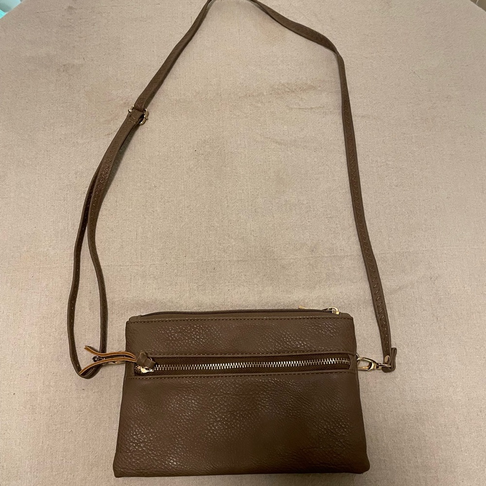 Small light grey crossover bag, no brand, bought at a boutique store in Tahoe.
